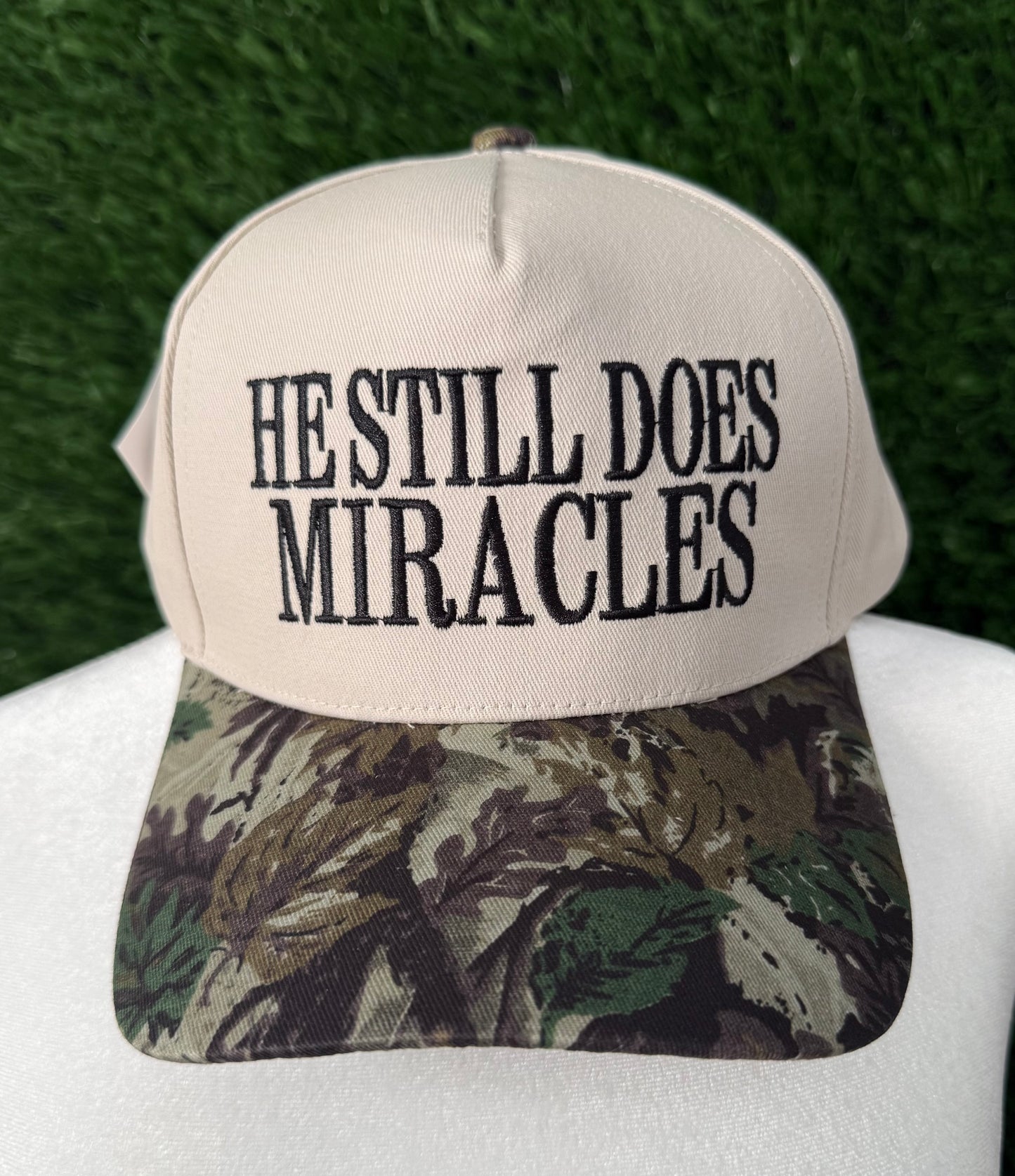 He Still Does Miracles Camo Trucker